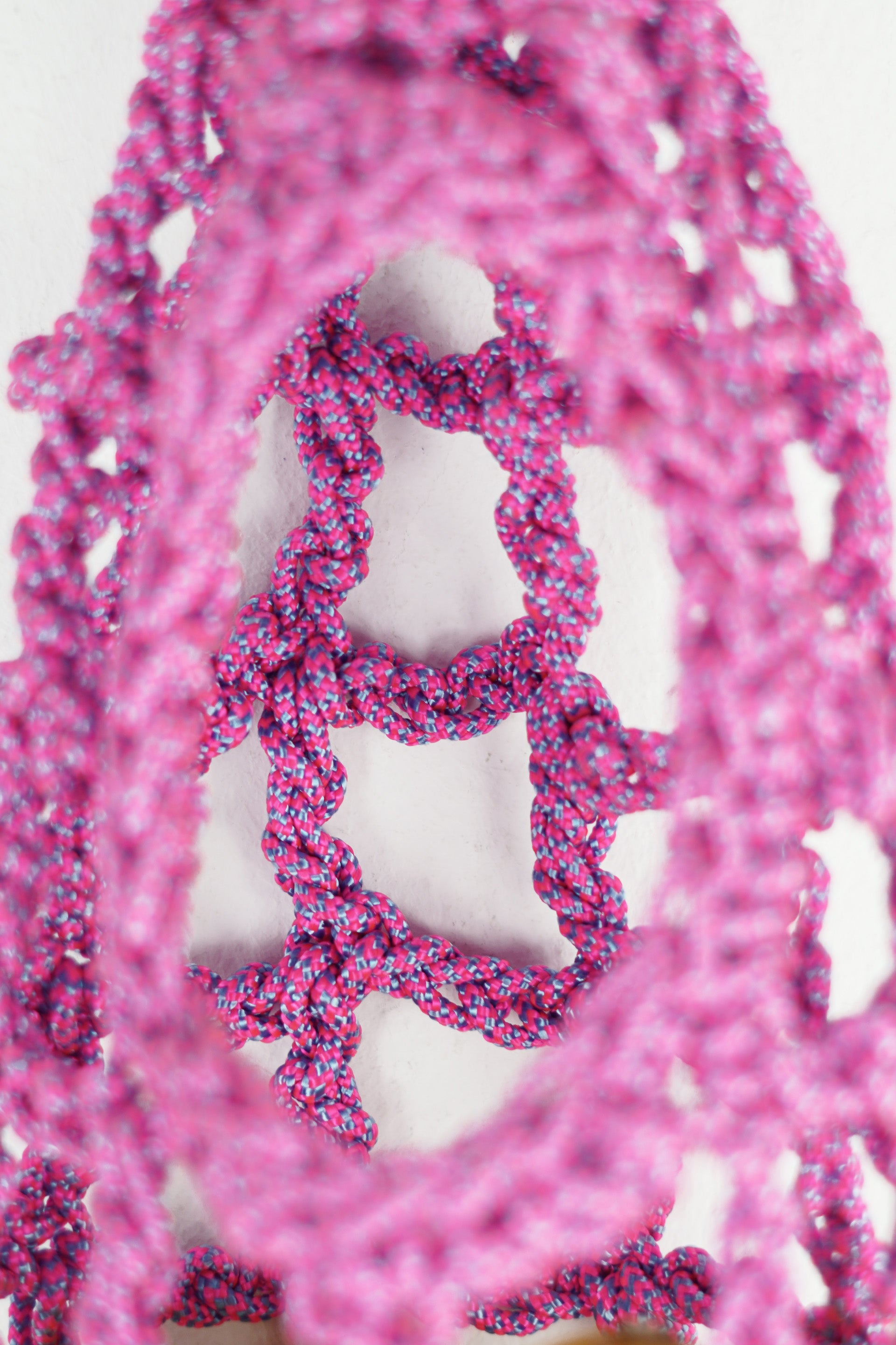 Pink and blue bag made of paracord rope