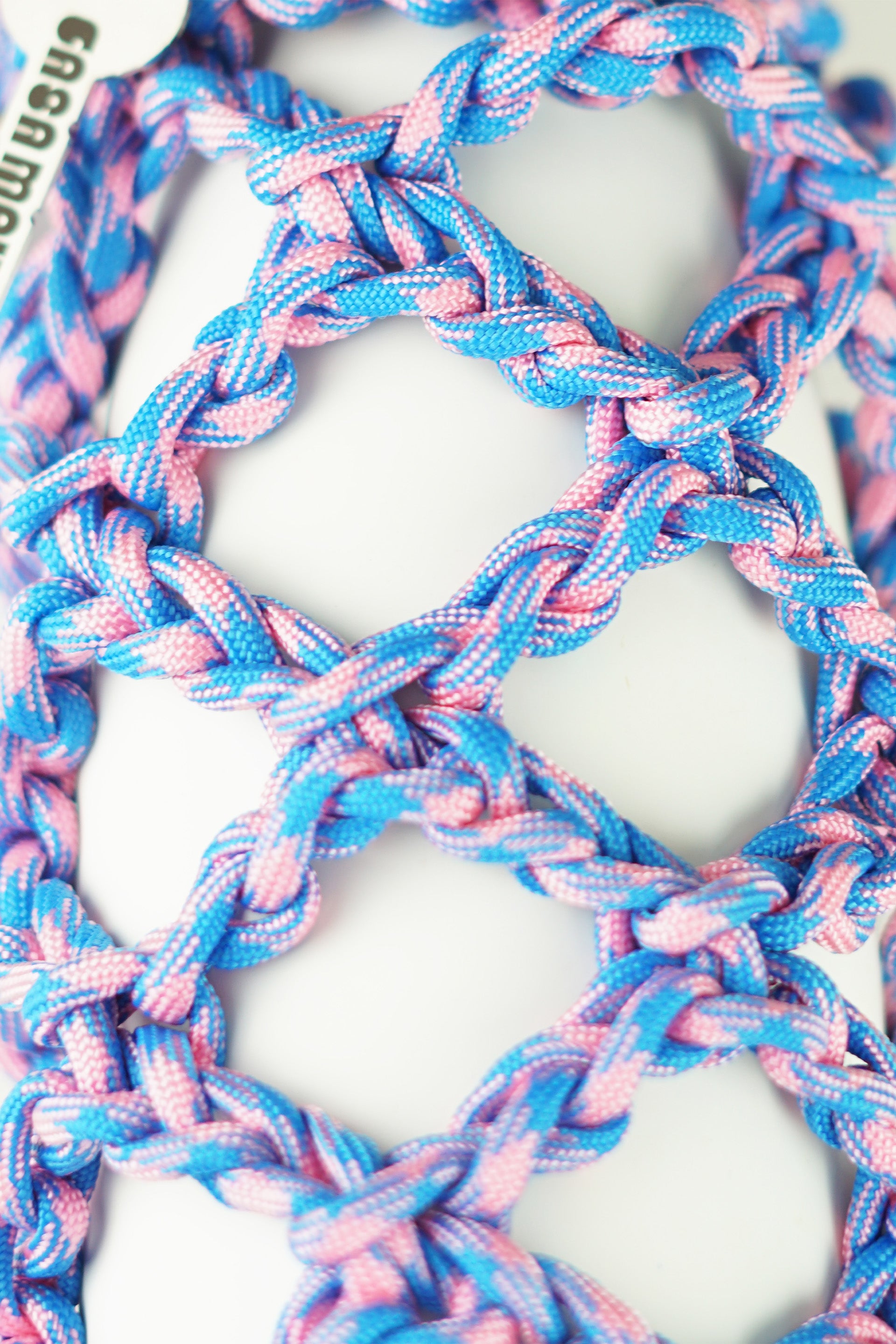 Pink and blue bottle porter made of paracord rope