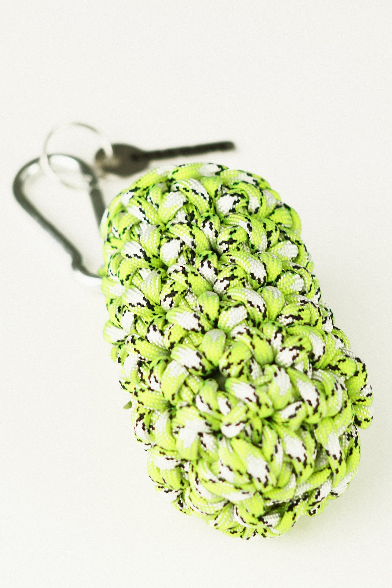 White and green pet bag holder made of paracord rope
