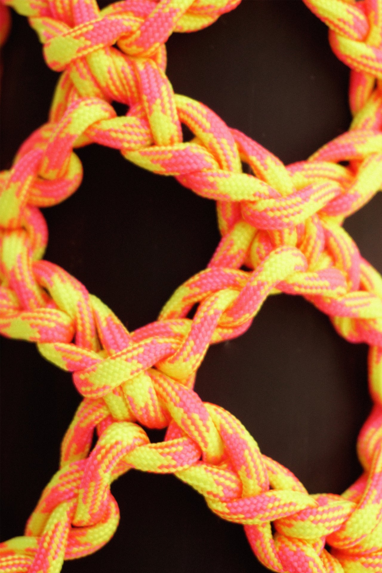 Yellow and pink water porter made of paracord rope