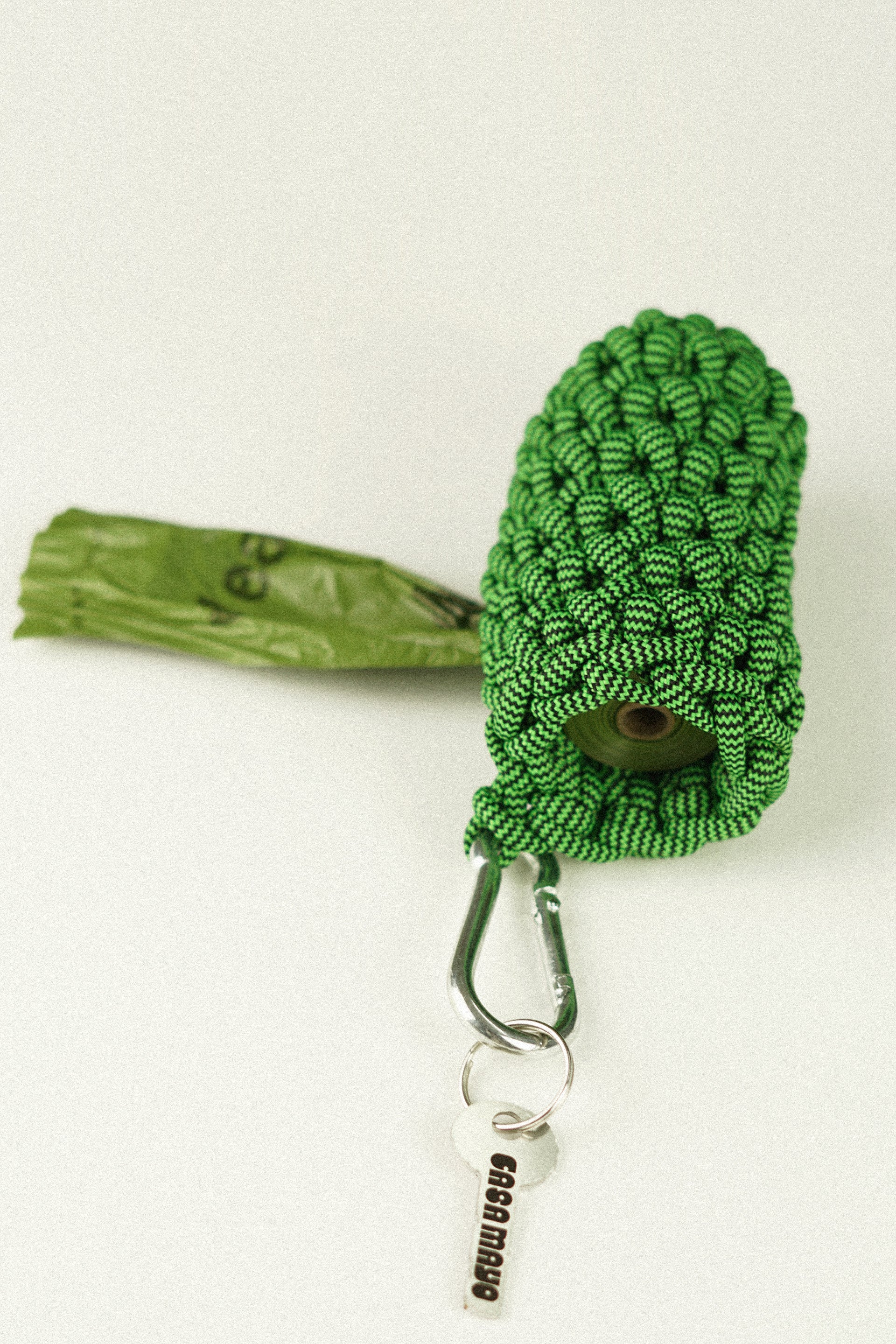 Green pet bag holder made of paracord rope